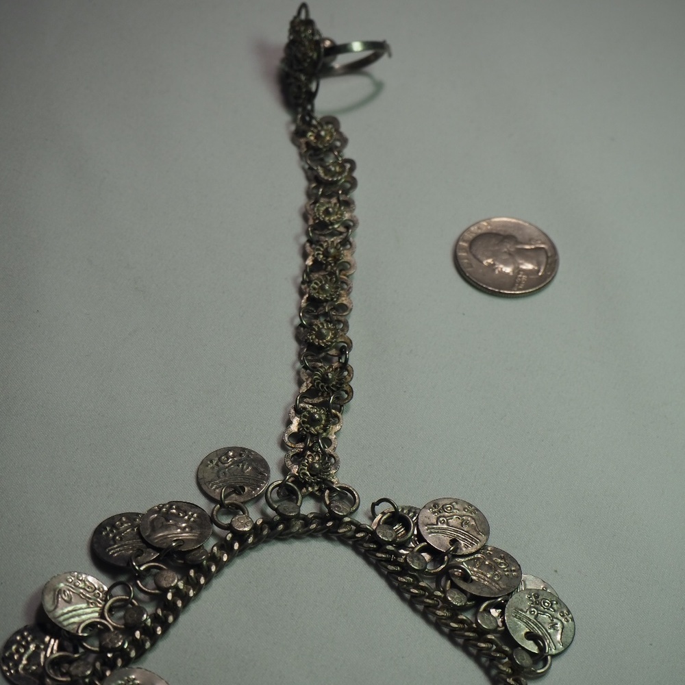 Silver bracelet connected to ring